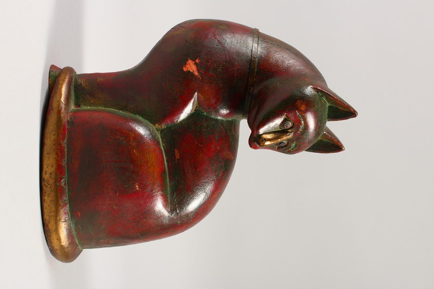 AN ISLAMIC CARVED SEATED CAT with brass nose, collar and bone. 21cms high. - Image 2 of 7