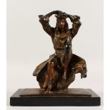 A VENTURI ARTS BRONZE OF A YOUNG LADY sitting on a rock, her hands on her head. Signed. No. 3/350.