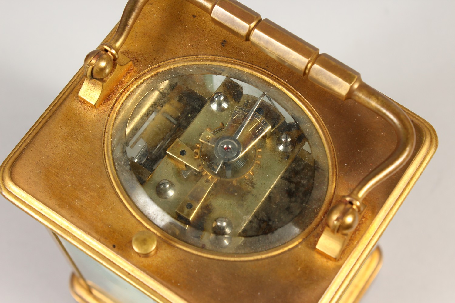 A FRENCH BRASS CARRIAGE CLOCK, with repeat and alarm, striking on a gong, in a leather case. 14cms - Image 10 of 14