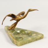 AN AUSTRIAN GILT BRONZE BIRD ASHTRAY, on onyx. 20cms long.