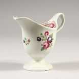 A LATE 18TH CENTURY NEWHALL CREAM JUG, CIRCA. 1790, painted with roses. 9.5cms high.