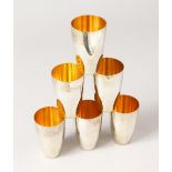 A SET OF SIX PLAIN .800 SILVER BEAKERS. Weight 16ozs.