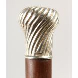 A CONTINENTAL ROSEWOOD CANE, with silver top. Maker: SK. 91cms long.