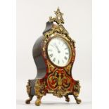 A SMALL FRENCH BOULLE MANTLE CLOCK with brass inlay. 28cms high.