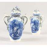 A PAIR OF BOOTHS BLUE AND WHITE BRITISH SCENERY ENCRUSTED TWO-HANDLED VASES AND COVERS. 23cms high.