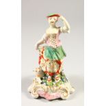 A DERBY PORCELAIN GROUP, YOUNG LADY, A LAMB AT HER SIDE, on a flower encrusted scrolled base.