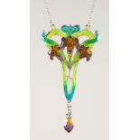 AN ART NOUVEAU STYLE SILVER AND ENAMEL FLOWER PENDANT AND CHAIN.