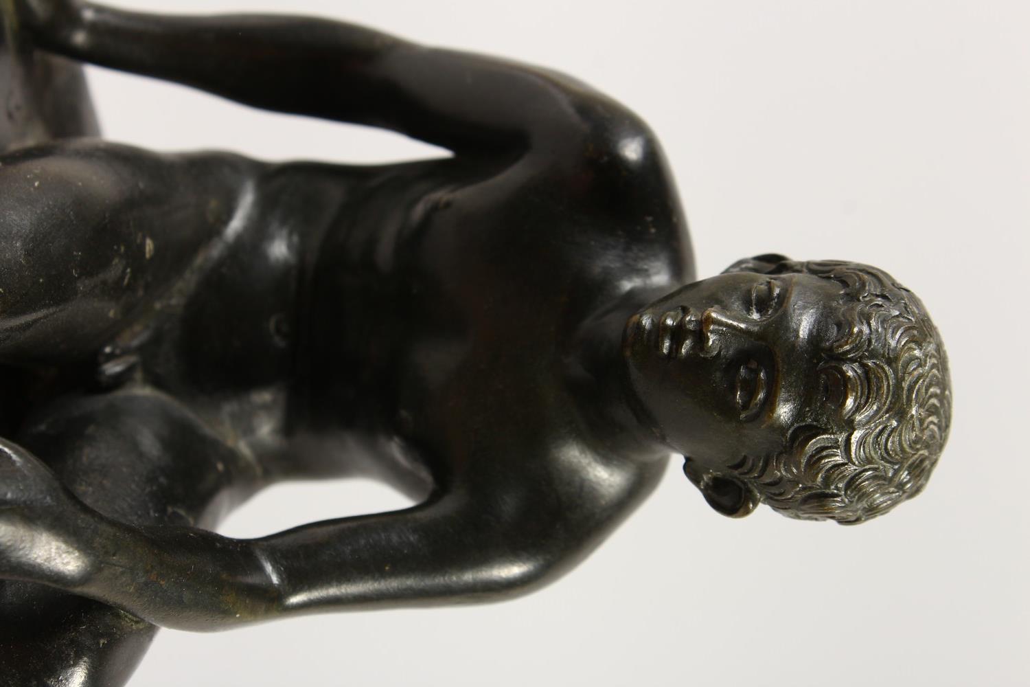 AFTER THE ANTIQUE A BRONZE OF HERMES, sitting on a rock. 19cms high. - Image 10 of 10