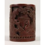A CHINESE BRONZE BRUSH POT, decorated with figures and landscapes. 14cms high.
