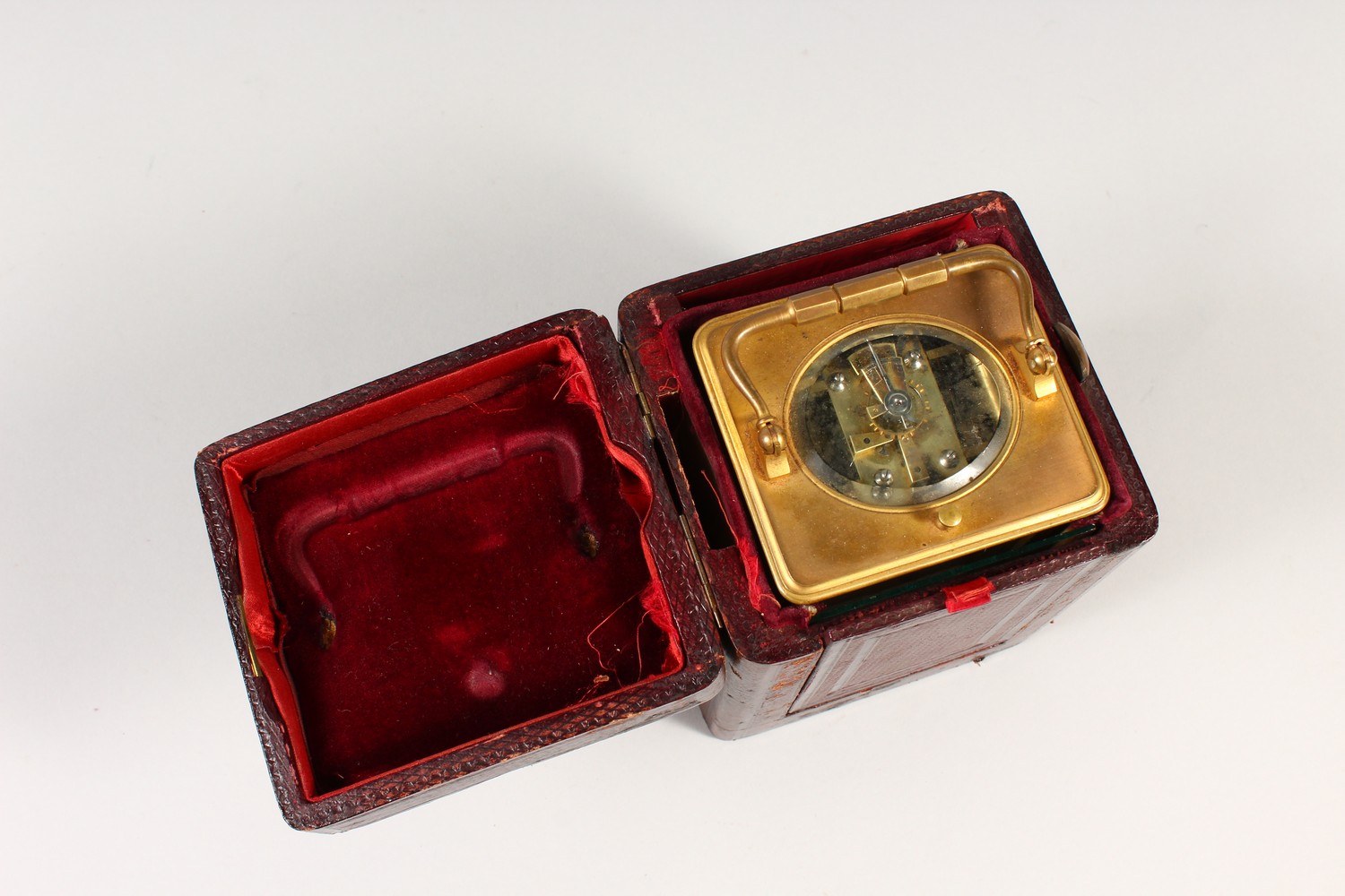 A FRENCH BRASS CARRIAGE CLOCK, with repeat and alarm, striking on a gong, in a leather case. 14cms - Image 14 of 14