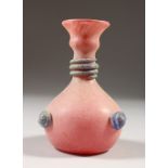 A ROMAN PINK TWO-HANDLED GLASS VASE.