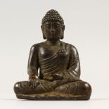 A SMALL CHINESE BRONZE SEATED BUDDHA. 5cms high.