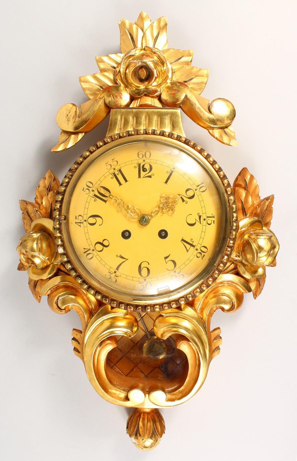 A FRENCH STYLE GILTWOOD CARTIER WALL CLOCK. 55cms high.