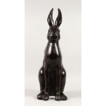 A BRONZE MODEL OF A SEATED HARE. 60cms high.