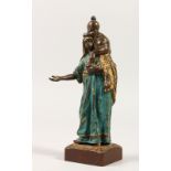 A COLD PAINTED BRONZE, modelled as a woman with a child on her shoulders. 17cms high.