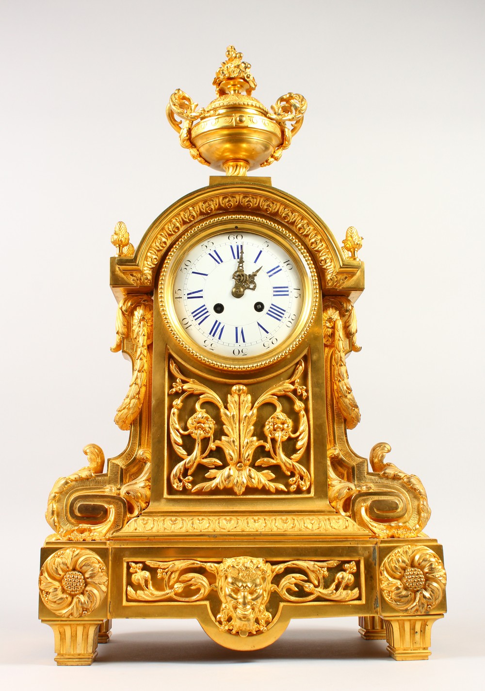 A 19TH CENTURY FRENCH ORMOLU MANTLE CLOCK, eight-day movement, striking on a bell, with white enamel