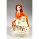 A STAFFORDSHIRE FIGURE, "RED RIDING HOOD AND THE WOLF".
