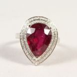 A 14K WHITE GOLD AND DIAMOND RING, set with a pear cut ruby approx. 7.43ct, diamonds approx. 0.