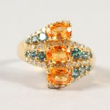 A 14CT YELLOW GOLD, CITRINE, TOURMALINE AND DIAMOND CROSSOVER RING.