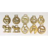 TEN VARIOUS ANTIQUE HORSE BRASSES, mostly horses and other animals.