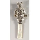 A TEDDY BEAR SILVER AND MOTHER-OF-PEARL BABIES RATTLE.