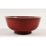 A CHINESE SANG DE BOEUF STYLE CIRCULAR BOWL. 19cms diameter.