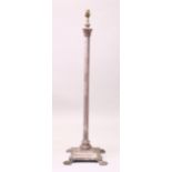 A SILVER PLATED CORINTHIAN COLUMN FLOOR STANDING LAMP, on claw feet. 125cms high.