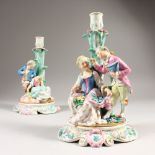 A PAIR OF AUGUSTUS REX PORCELAIN CANDLESTICK GROUPS, gallant and lady on an oval base. Mark in blue.