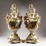 A PAIR OF MEISSEN STYLE VASES, COVERS AND STANDS, with cherub and floral encrusted decoration. 73cms