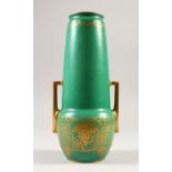 A ROYAL WORCESTER ART DECO GREEN TWO-HANDLED VASE, with gilt handles and gilt fruiting vines.