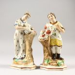 A PAIR OF WHIELDON FIGURES, young man and girl with dogs, on a pedestal. 6.5ins high.