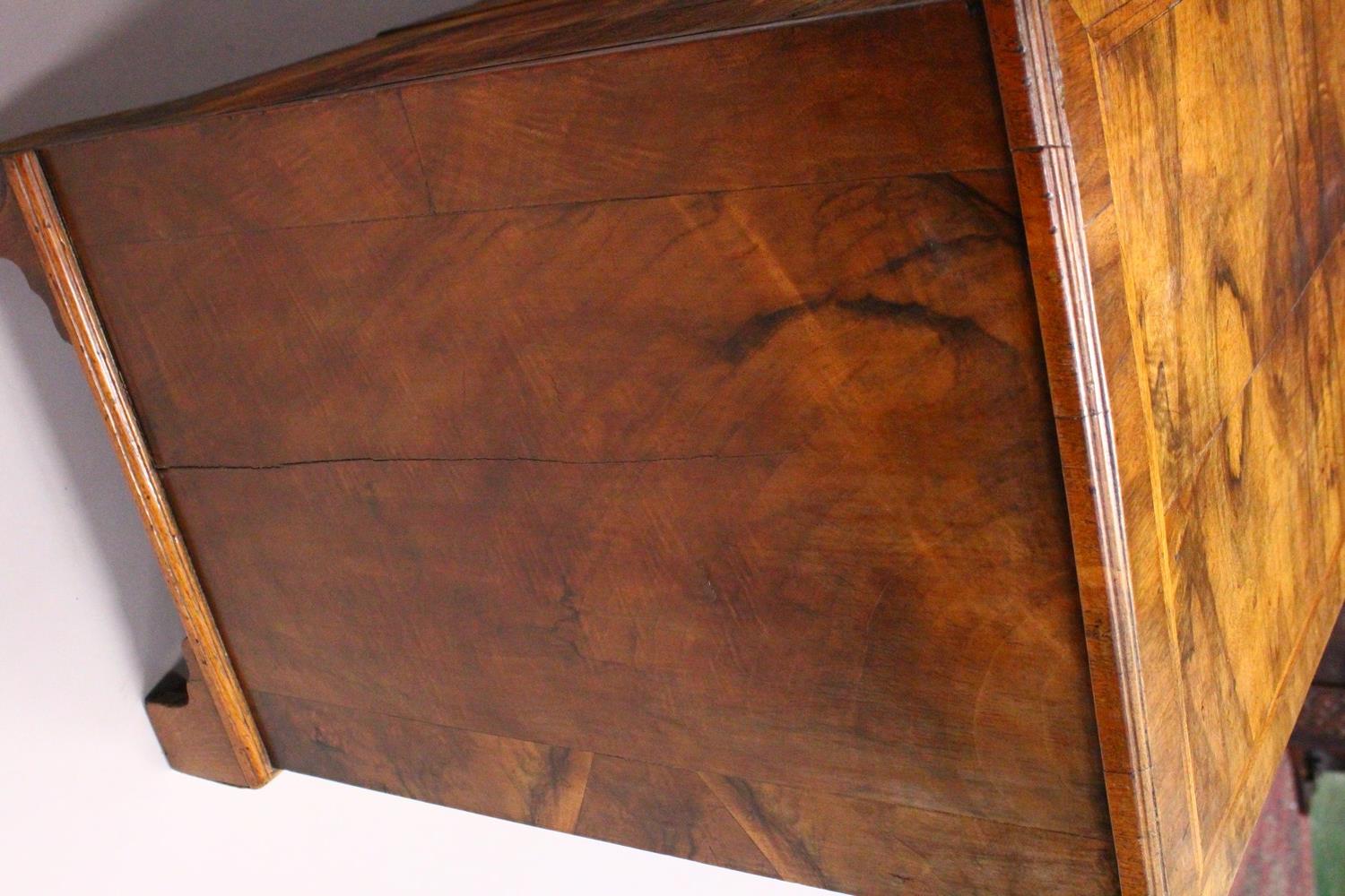 AN 18TH CENTURY WALNUT KNEEHOLE DESK, with quarter veneered top, one frieze drawer, a central - Image 8 of 17