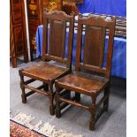 A PAIR OF 18TH CENTURY OAK DINING CHAIRS.