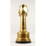 A VERY GOOD EARLY 20TH CENTURY BRASS LIGHTHOUSE, with clock, barometer and two thermometers. 44cms
