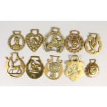 TEN VARIOUS ANTIQUE HORSE BRASSES, jockey, swan, hand, coin, etc.