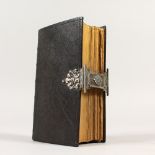 A 19TH CENTURY CONTINENTAL SILVER MOUNTED BIBLE. 16cms high.