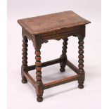 AN 18TH CENTURY OAK JOINT STOOL, with a moulded top, shaped frieze on bobbin turned legs united by