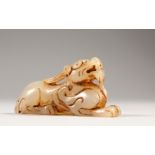 A SMALL CHINESE WHITE JADE CARVED LION. 6.5cms long.