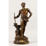 AFTER MAURICE CONSTANT "LE TRAVAIL", a bronze group of a man standing beside an anvil, on a circular