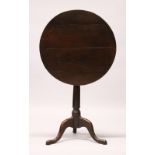 A GEORGE III YEW WOOD TILT TOP TRIPOD TABLE, with a circular top and turned column support. 60cms