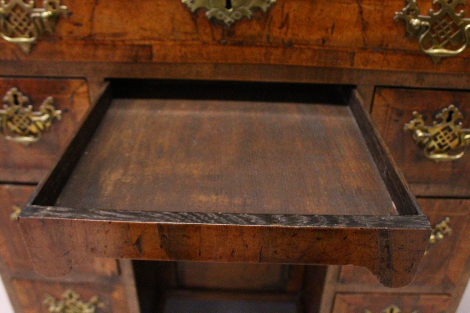 AN 18TH CENTURY WALNUT KNEEHOLE DESK, with quarter veneered top, one frieze drawer, a central - Image 14 of 17