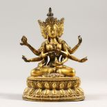 AN INDIAN GILT BRONZE MULTI ARM DEITY, seated on a lotus pod. 18cms high.