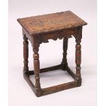 AN 18TH CENTURY OAK JOINT STOOL, with a carved top, shaped frieze on turned legs united by