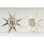 A PAIR OF .800 SILVER MALTESE STARS.