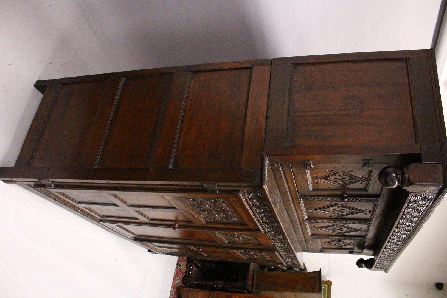 A 17TH/18TH CENTURY OAK COURT CUPBOARD, with carved frieze over two carved central panels flanked by - Image 7 of 10