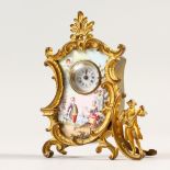 A SMALL FRENCH GILT METAL AND ENAMEL CLOCK with figures. 7cms high.