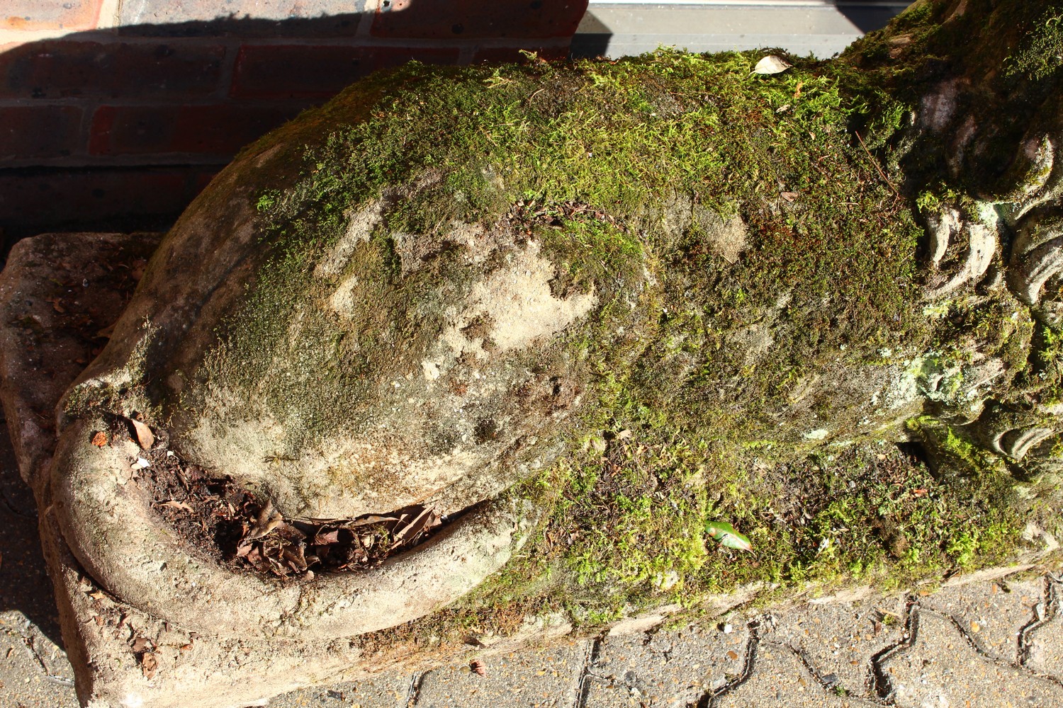 AN IMPOSING PAIR OF RECONSTITUTED STONE LIONS, in a recumbent pose, each looking to the side. 128cms - Image 8 of 10