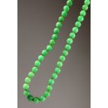 A CHINESE JADE BEAD NECKLACE. 80cms long.