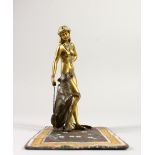 A BERGMAN STYLE COLD CAST BRONZE, a standing nude with a bear on a carpet. 16cms high x 15.5cms