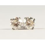 A PAIR OF 14CT WHITE GOLD DIAMOND STUD EARRINGS of 1.21cts.